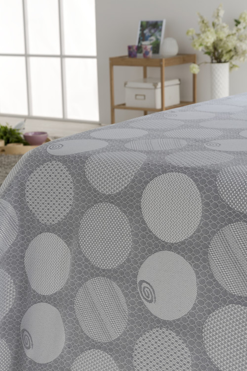 COLCHA TEJIDO JACQUARD CON ESTAMPADO DE LUNARES