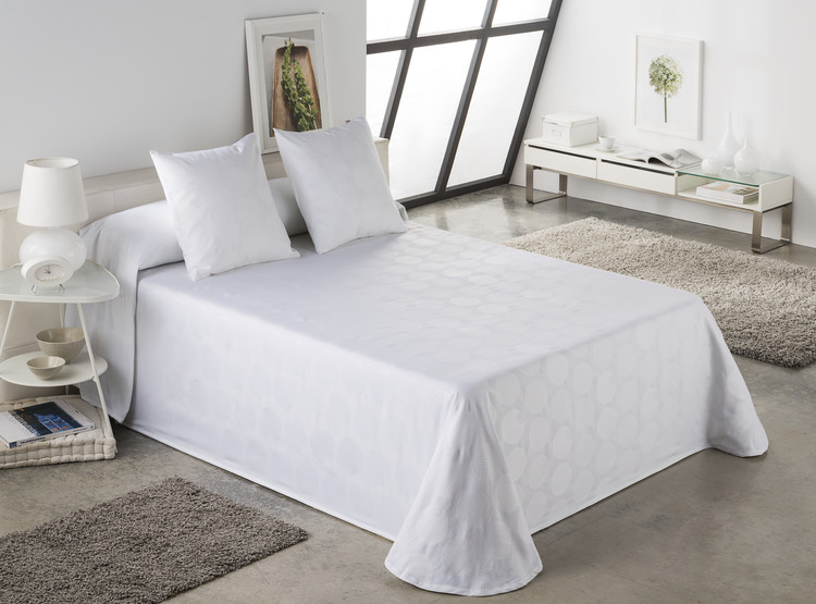 COLCHA TEJIDO JACQUARD CON ESTAMPADO DE LUNARES
